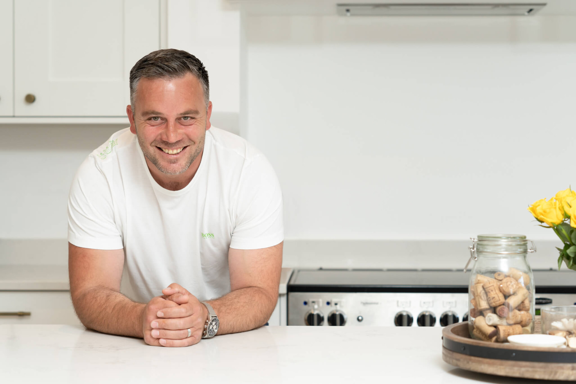 The founder of The Construction Clinic in a completed family kitchen